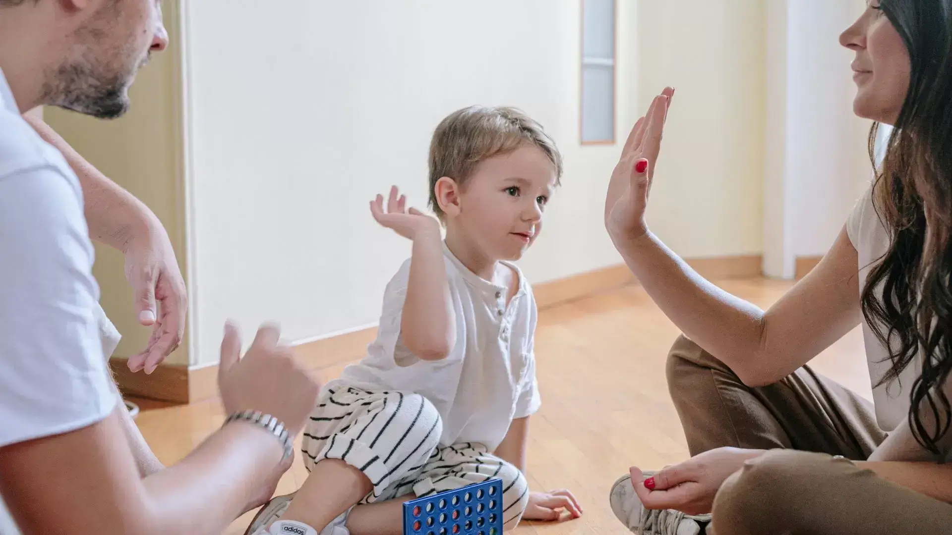 Parent engaging in a meaningful activity with their child, reflecting a child-centered approach supported by Mississauga Divorce Counselling Therapy in co-parenting after divorce.