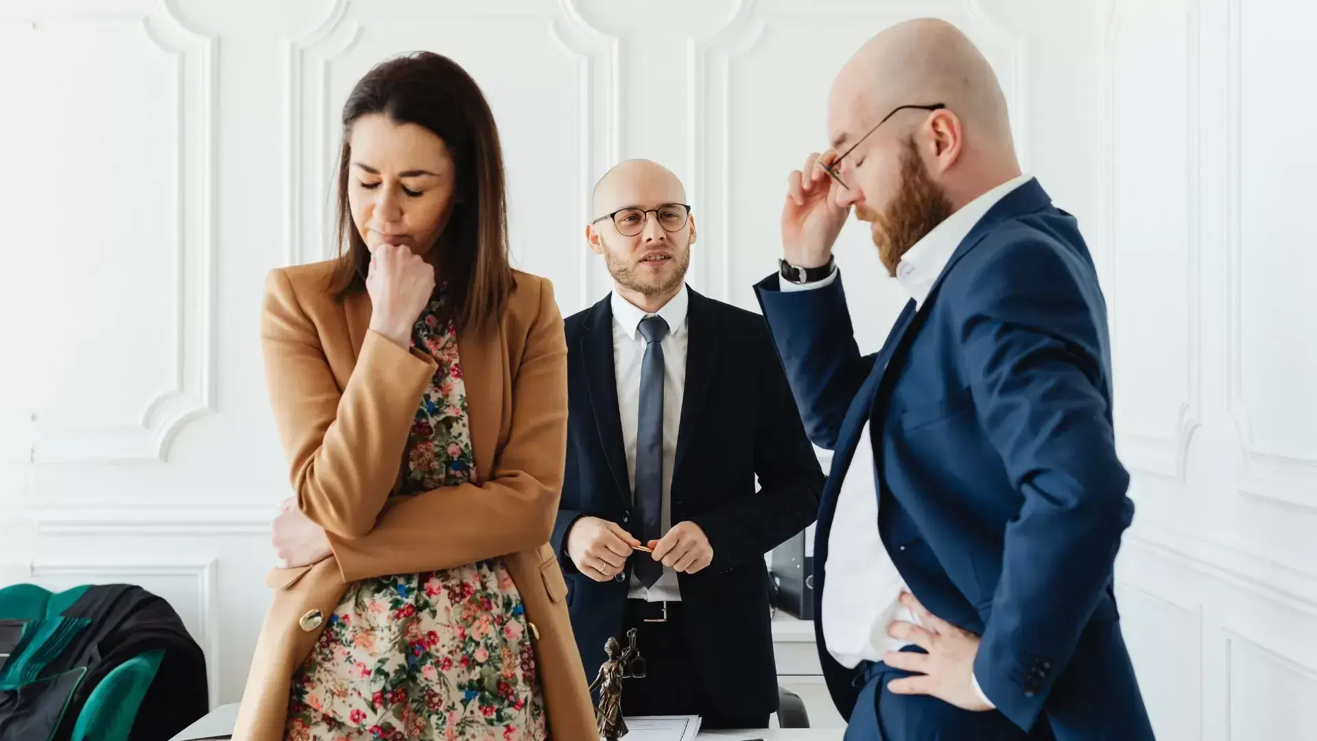 Man appearing to apologize while his partner looks away during a divorce counselling session at Mississauga Divorce Counselling Therapy, illustrating the challenges and progress in moving toward cooperative solutions.