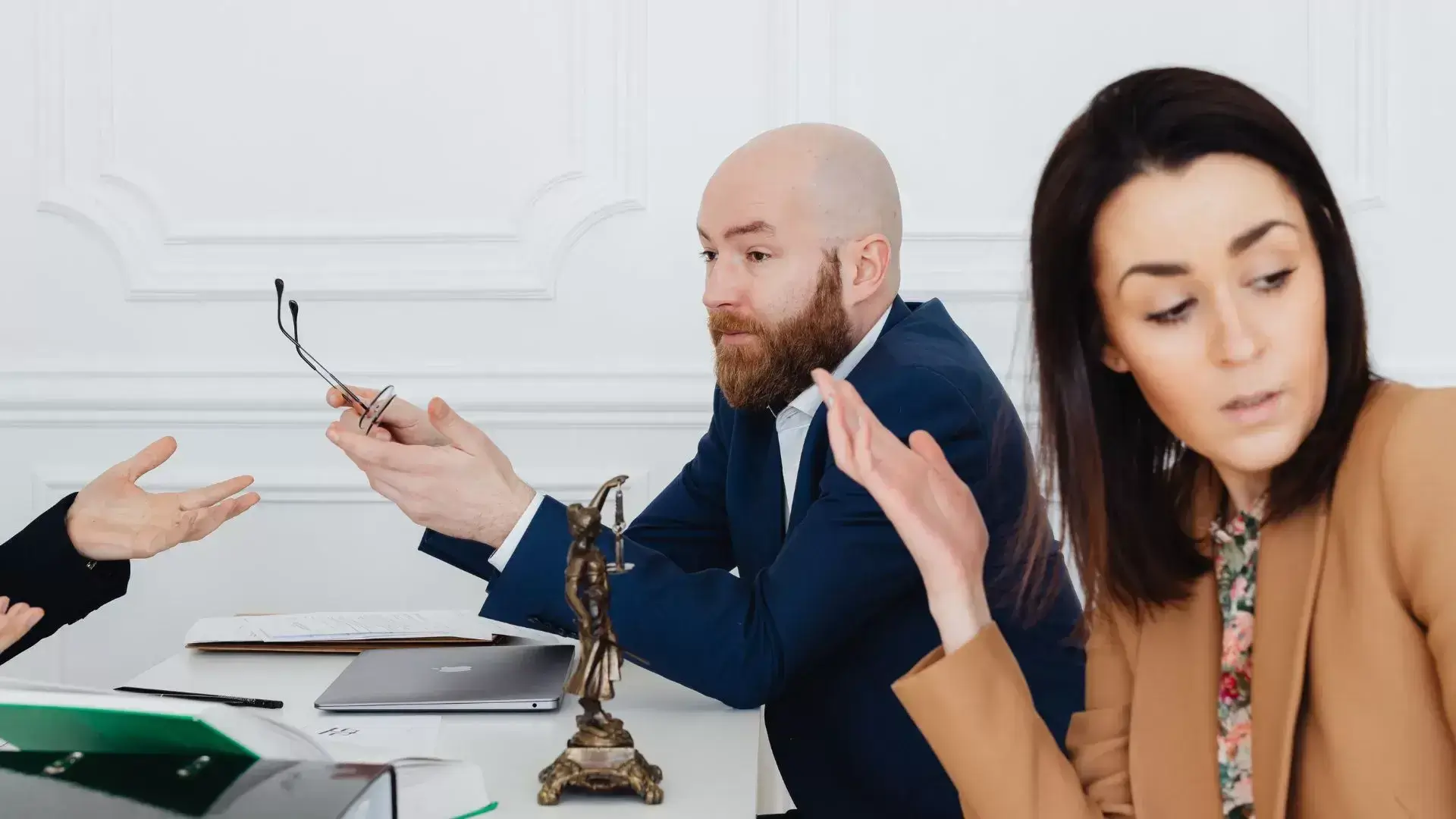 Couple in visible conflict during a session with a divorce therapist at Mississauga Divorce Counselling Therapy, highlighting the emotional challenges and role of conflict during divorce.